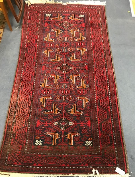 A Caucasian red ground rug 190 x 100cm
